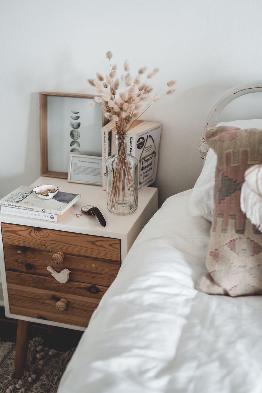 cozy light interior of comfy bed and bedside table